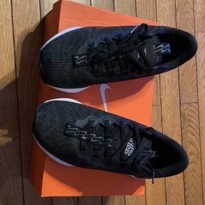 Nike Motiva Women & Men Black and White Walking Sneakers